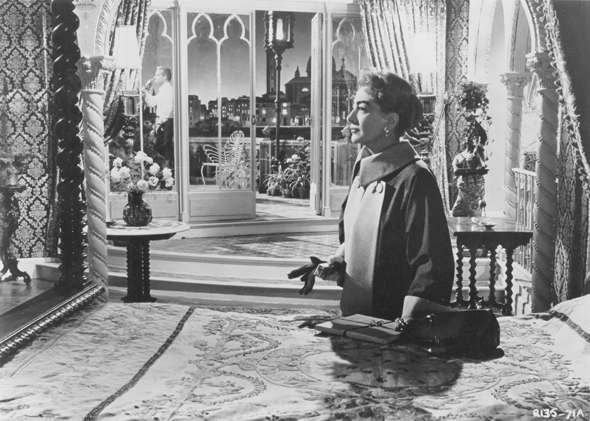 Joan Crawford visits Rossano Brazzi in The Story of Esther Costello
